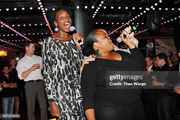 Professional tennis player Venus Williams and Principal and Co-Founder of Wishbone Consulting Group Isha Price sing onstage at Driving Force Giving...