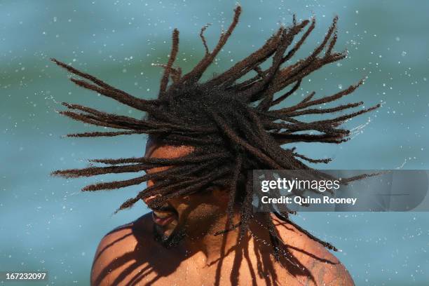 Harry O'Brien of the Magpies shakes his hair as he comes out of the water during a Collingwood Magpies AFL recovery session at the St Kilda Sea Baths...