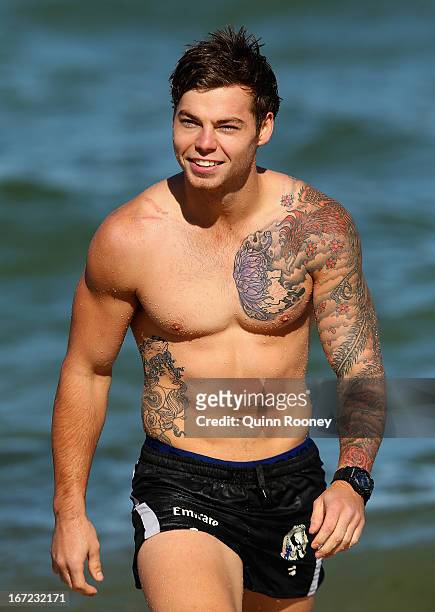 Jaimie Elliott of the Magpies comes out of the water during a Collingwood Magpies AFL recovery session at the St Kilda Sea Baths on April 23, 2013 in...