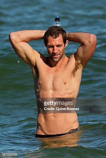 Travis Cloke of the Magpies wades in the water during a Collingwood Magpies AFL recovery session at the St Kilda Sea Baths on April 23, 2013 in...