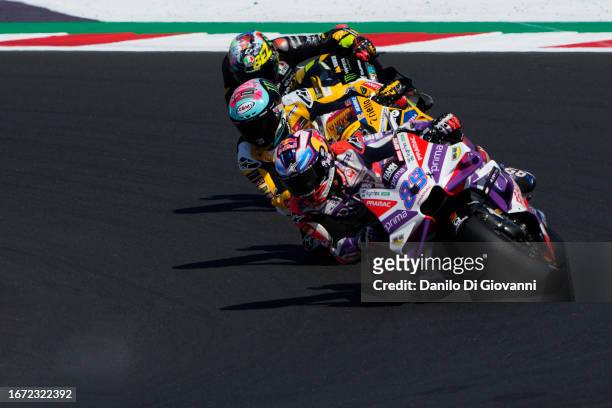 Jorge Martin of Spain and Prima Pramac Racing rides in front of Francesco Bagnaia of Italy and Ducati Lenovo Team and Marco Bezzecchi of Italy and...