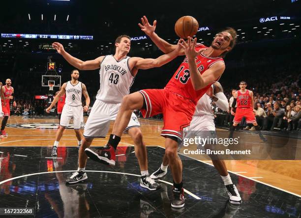 Kris Humphries of the Brooklyn Nets blocks a shot by Joakim Noah of the Chicago Bulls during Game Two of the Eastern Conference Quarterfinals of the...