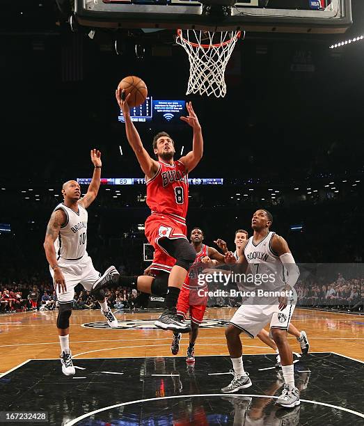 Marco Belinelli of the Chicago Bulls goes up and scores two against the Brooklyn Nets in the second half during Game Two of the Eastern Conference...