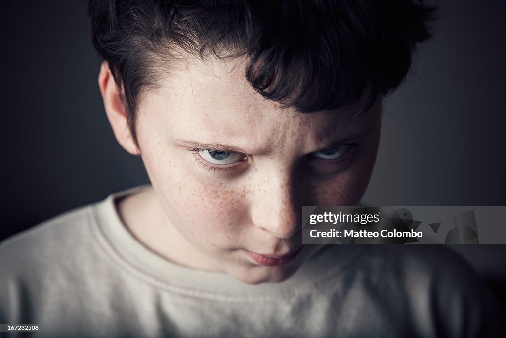 Portrait of child with angry expression