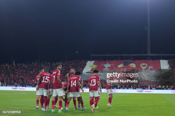 Players of Al-Ahly are posing for a picture ahead of the CAF Super Cup football match between Egypt's Al-Ahly and Algeria's USM Alger at the King...