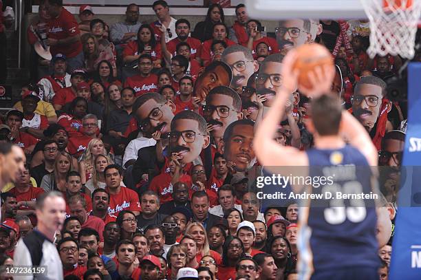 Marc Gasol of the Memphis Grizzlies attempts free throws while fans hold up cardboard cutouts of Chris Paul of the Los Angeles Clippers at Staples...