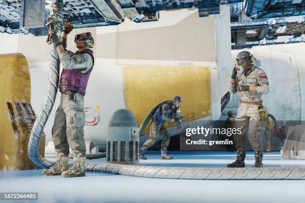 futuristic technicians working on space rocket engine - rocket engine stock pictures, royalty-free photos & images
