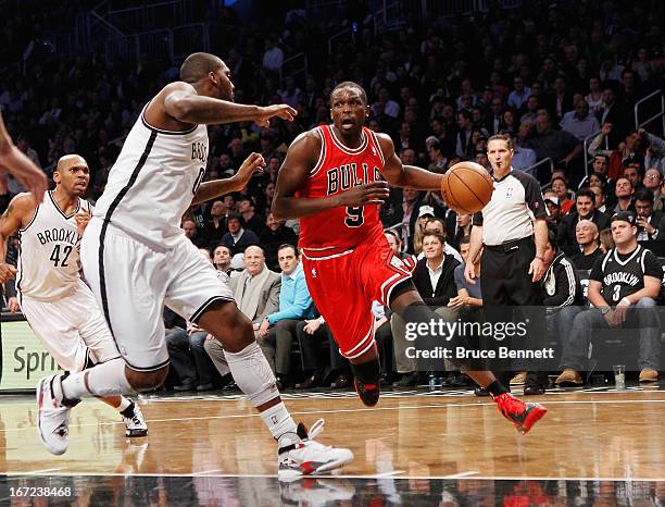 Luol Deng of the Chicago Bulls dribbles the ball against the Brooklyn Nets during Game Two of the Eastern Conference Quarterfinals of the 2013 NBA...