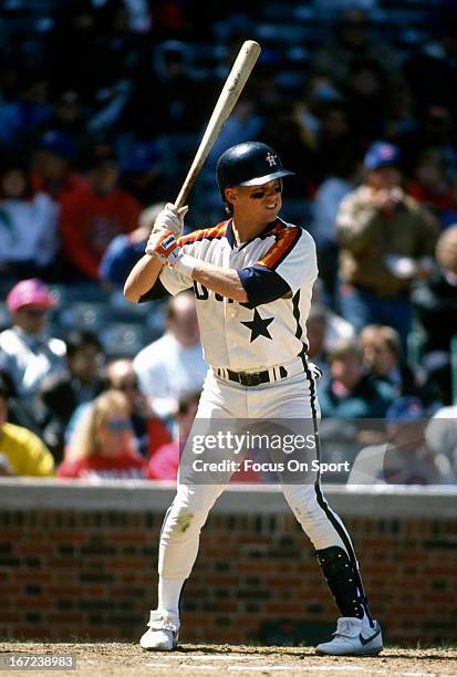 Craig Biggio of the Houston Astros bats against the Chicago Cubs during an Major League Baseball game circa 1990 at Wrigley Field in Chicago,...