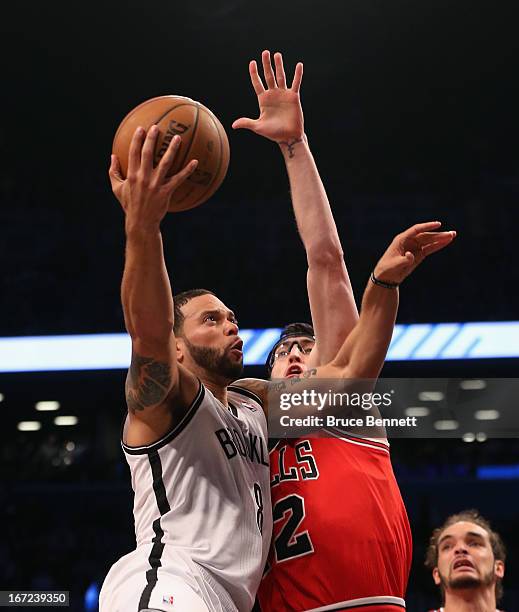 Deron Williams of the Brooklyn Nets takes the shot against the Chicago Bulls during Game Two of the Eastern Conference Quarterfinals of the 2013 NBA...