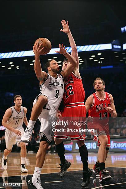 Deron Williams of the Brooklyn Nets takes the shot against the Chicago Bulls during Game Two of the Eastern Conference Quarterfinals of the 2013 NBA...