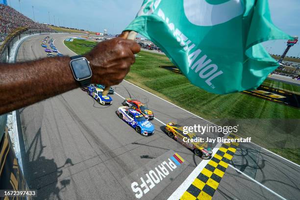 Christopher Bell, driver of the DEWALT Perform & Protect Toyota, leads the field to the green flag to start the NASCAR Cup Series Hollywood Casino...