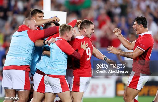 George North of Wales celebrates with teammates after scoring his team's second try during the Rugby World Cup France 2023 match between Wales and...