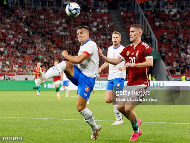 Tomas Holes of Czech Republic fights for the possession with Roland Sallai of Hungary during the International Friendly match between Hungary and...