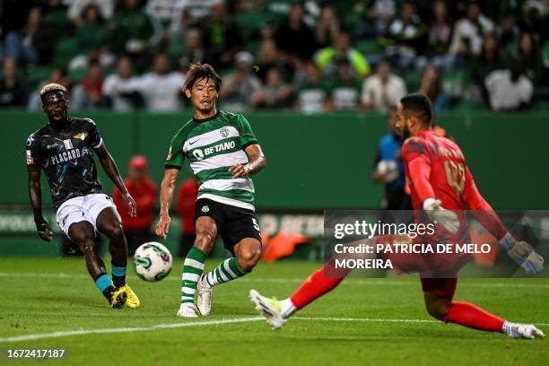 Sporting's Japanese midfielder Hidemasa Morita airs with Moreirense's Ghanaian midfielder Lawrence Ofori and Moreirense's Brazilian goalkeeper Kewin...