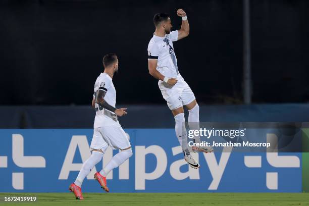 Zan Vipotnik of Slovenia celebrates with team mates after scoring to give the side a 1-0 lead during the UEFA EURO 2024 European qualifier match...