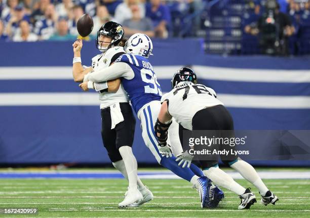 Trevor Lawrence of the Jacksonville Jaguars fumbles the ball as he is sacked by DeForest Buckner of the Indianapolis Colts in the third quarter at...