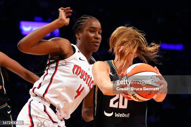 Sabrina Ionescu of the New York Liberty moves against Queen Egbo of the Washington Mystics at Barclays Center on September 10, 2023 in the Brooklyn...