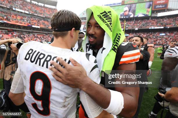 Joe Burrow of the Cincinnati Bengals and Myles Garrett of the Cleveland Browns meet on the field following the Browns 24-3 winat Cleveland Browns...