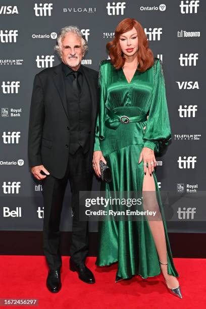 John Herzfeld and Rebekah Chaney attend Netflix's "Sly" world premiere during the Toronto International Film Festival at Roy Thomson Hall on...