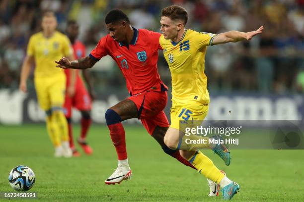 Viktor Tsygankov of Ukraine battles for possession with Marcus Rashford of England during the UEFA EURO 2024 European qualifier match between Ukraine...