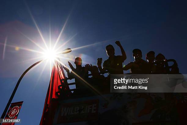 Western Sydney Wanderers players ride on a bus amongst fans during a Western Sydney Wanderers A-League Civic Reception on April 23, 2013 in...