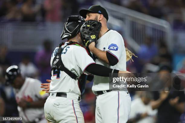 Nick Fortes and Jacob Stallings of the Miami Marlins celebrate their win over the the Atlanta Braves at loanDepot park on Sunday, September 17, 2023...