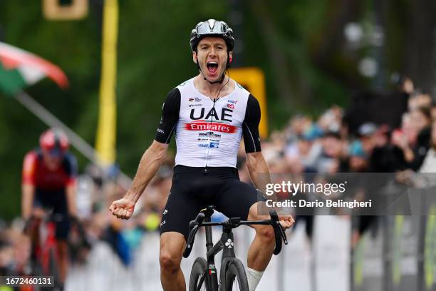 Adam Yates of Great Britain and UAE Team Emirates celebrates at finish line as race winner during to the 12th Grand Prix Cycliste de Montreal 2023 a...