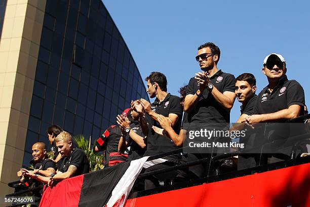 Western Sydney Wanderers players ride on a bus amongst fans during a Western Sydney Wanderers A-League Civic Reception on April 23, 2013 in...