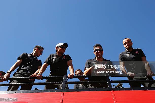 Western Sydney Wanderers players ride on a bus amongst fans during a Western Sydney Wanderers A-League Civic Reception on April 23, 2013 in...