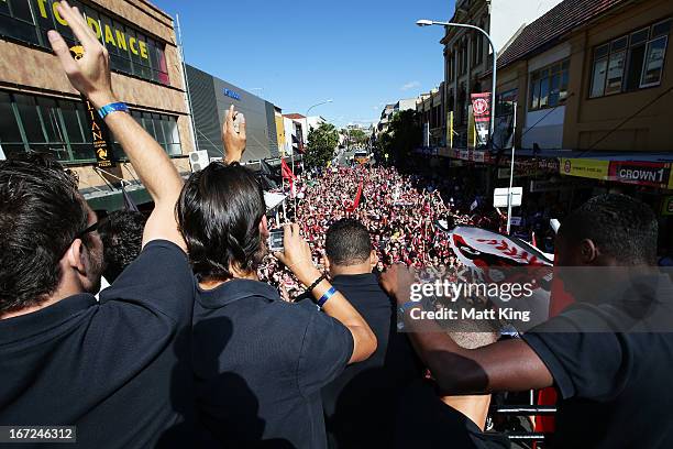 Western Sydney Wanderers players ride on a bus amongst fans during a Western Sydney Wanderers A-League Civic Reception on April 23, 2013 in...