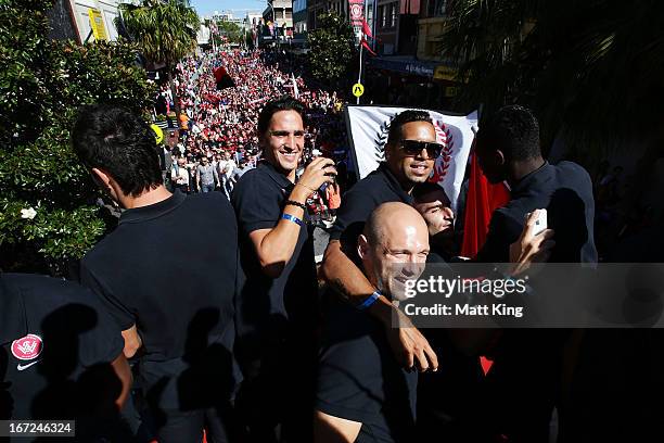 Western Sydney Wanderers players ride on a bus amongst fans during a Western Sydney Wanderers A-League Civic Reception on April 23, 2013 in...