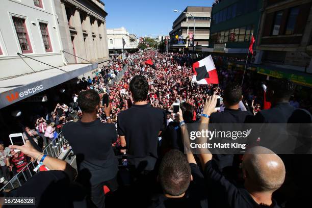 Western Sydney Wanderers players ride on a bus amongst fans during a Western Sydney Wanderers A-League Civic Reception on April 23, 2013 in...