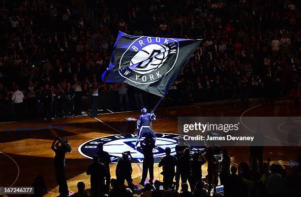 BrooklyKnight waves Nets flag before the Chicago Bulls Vs Brooklyn Nets Playoff Game at the Barclays Center on April 22, 2013 in the Brooklyn borough...