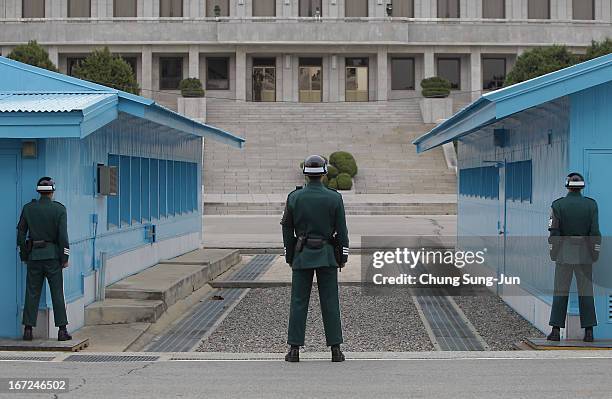 South Korean soldiers stand guard at the border village of Panmunjom between South and North Korea at the Demilitarized Zone on April 23, 2013 in...