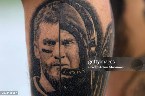 Tattoo of former New England Patriots quarterback Tom Brady and head coach Bill Belichick of the New England Patriots on a New England Patriots fan...