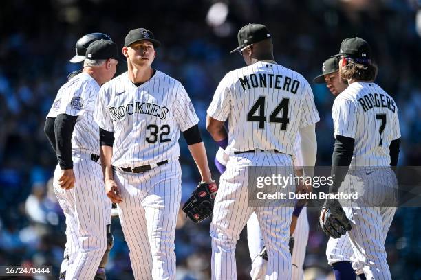 Chris Flexen of the Colorado Rockies is relieved by manager Bud Black in the sixth inning of a game against the San Francisco Giants at Coors Field...