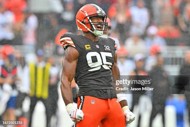Myles Garrett of the Cleveland Browns celebrates after sacking Joe Burrow of the Cincinnati Bengals during the second half at Cleveland Browns...