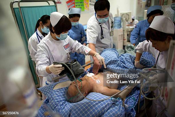 Medical officers treat an earthquake victim at the West China Hospital in Chengdu, on April 22, 2013 in China. A powerful earthquake struck the steep...