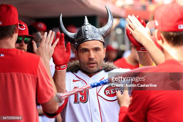Joey Votto of the Cincinnati Reds celebrates a home run on his 40th birthday during the eighth inning against the St. Louis Cardinals at Great...