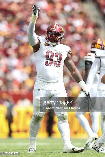 Jonathan Allen of the Washington Commanders reacts after making a sack against the Arizona Cardinals during a game at FedExField on September 10,...