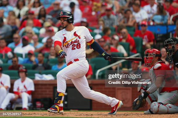 Nolan Arenado of the St. Louis Cardinals hits an RBI single against the Philadelphia Phillies in the fifth inning at Busch Stadium on September 17,...