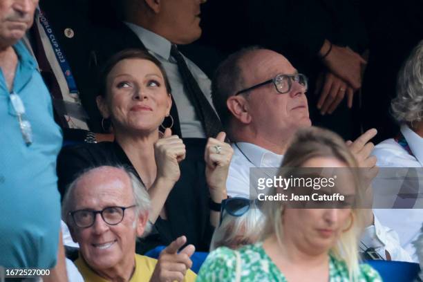 Princess Charlene of Monaco - celebrating a try for South Africa - and Prince Albert II of Monaco attend the Rugby World Cup France 2023 match...