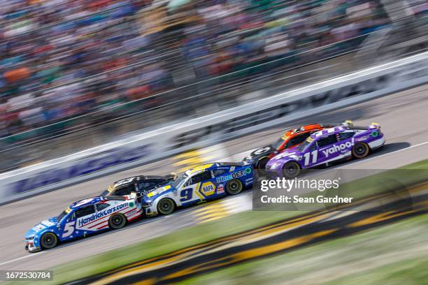 Kyle Larson, driver of the HendrickCars.com Chevrolet, Bubba Wallace, driver of the Columbia Sportswear Company Toyota, Chase Elliott, driver of the...