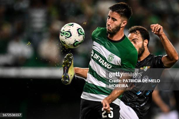 Sporting's Portuguese defender Goncalo Inacio vies with Moreirense's Brazilian defender Marcelo during the Portuguese League football match between...