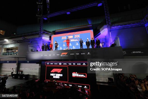 The winners podium after Carlos Sainz of Spain and Scuderia Ferrari won the race, with Lando Norris of Great Britain and McLaren Formula 1 Team...