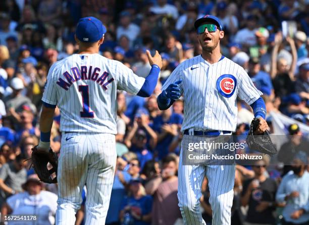 Nick Madrigal and Cody Bellinger of the Chicago Cubs celebrate after their team win over the Arizona Diamondbacks at Wrigley Field on September 10,...