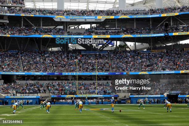 Cameron Dicker of the Los Angeles Chargers kicks the ball off to start a game against the Miami Dolphins at SoFi Stadium on September 10, 2023 in...