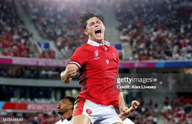 Louis Rees-Zammit of Wales celebrates victory at the final whistle following the Rugby World Cup France 2023 match between Wales and Fiji at Nouveau...