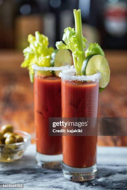 glasses of bloody mary cocktail - bloody mary stock pictures, royalty-free photos & images